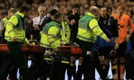 Fabrice Muamba of Bolton Wanderers Football Club is taken off on a stretcher after receiving CPR on the pitch.